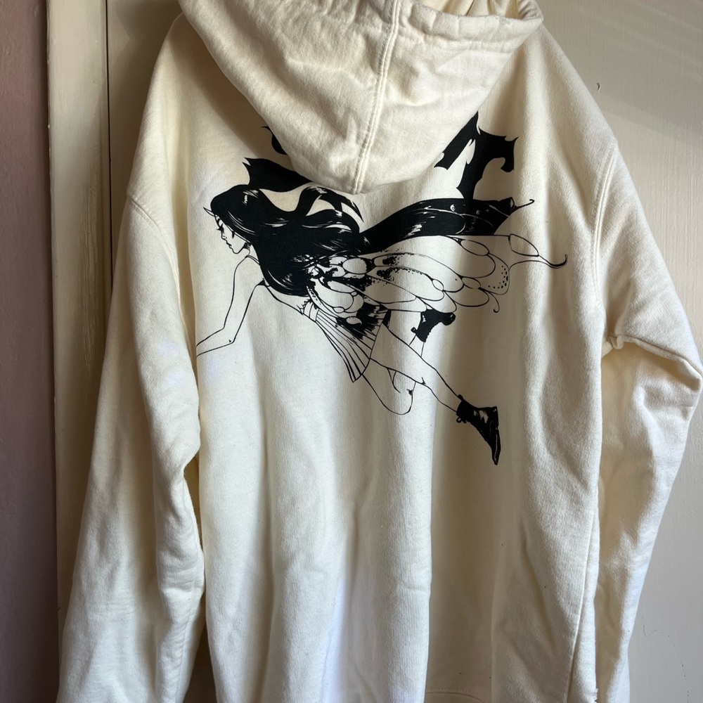 Cream Graphic Hoodie Sweatshirt with Black Fairy Print
